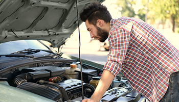 A man repairing his car